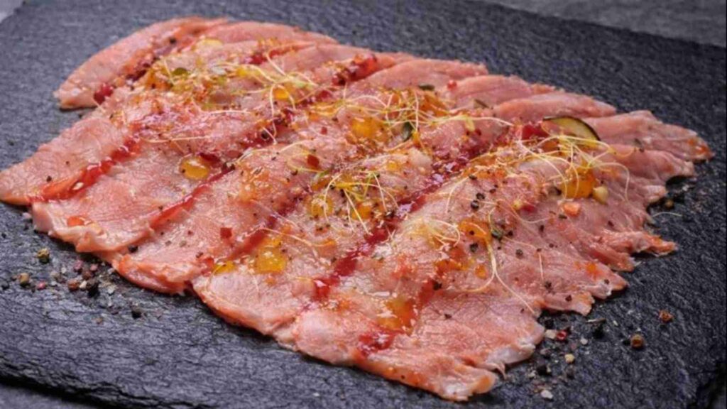 Carpaccio tiepido di lonzino marinato agli agrumi