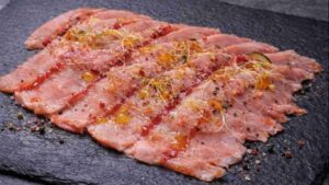 Carpaccio tiepido di lonzino marinato agli agrumi